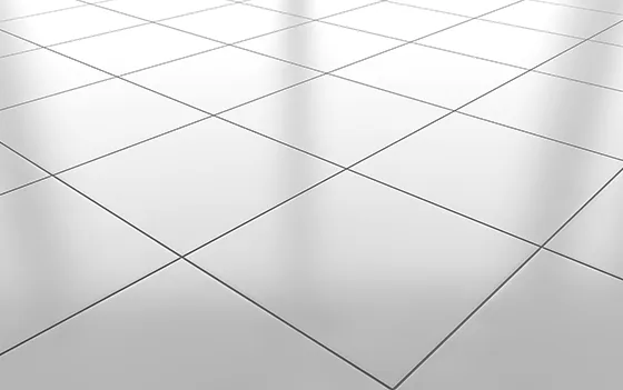 A seamless white tile floor against a plain white background, creating a clean and minimalist aesthetic